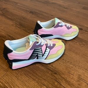 Girls New Balance, pink, yellow, black and white detail on the N